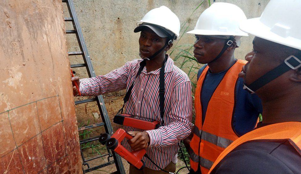 Engineers carrying out non-destructive testing on a bridge element